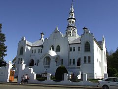 Building of the Nederduitse Gereformeerde Kerk in Swellendam, also known as the "Wit Kerk" by locals (originally built 1798). It is a replica of a famous steeple in Belgium