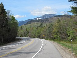 New Hampshire Route 16 in Martin's Location, May 2019. Mount Washington rises to the south, outside the township.