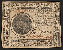 A seven-dollar banknote issued by the Second Continental Congress in 1775 with the inscription: ""SEVEN DOLLARS. THIS Bill entitles the Bearer to receive SEVEN SPANISH milled DOLLARS, or the Value thereof in Gold or Silver, according to a Resolution of CONGRESS, passed at Philadelphia November 29, 1775." ; Within border cuts: "Continental Currency" and "The United Colonies". ; Within circle: "SERENABIT." ; Verso: "SEVEN DOLLARS. PHILADELPHIA: Printed by HALL and SELLERS. 1775."