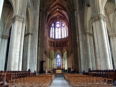 The massive pillars, surrounded by colonettes, and topped with floral capitals, of Reims Cathedral