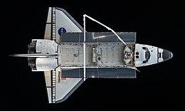 Top view of a spaceplane in space.