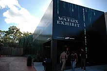 A futuristic, monolith-style black building that houses the Official Matrix Exhibit.