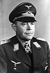 Head-and-shoulders portrait of a uniformed Nazi German air force general in his 50s wearing an Iron Cross.