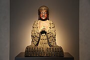 Ming dynasty bronze statue of Vairocana. Displayed at the Buddhism Sculpture Gallery in Aurora Museum, Pudong, Shanghai.