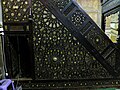 The minbar of the mosque, made of wood with geometric star patterns inlaid with ivory.