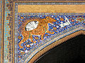 Mosaic representations the lion and sun on the façade of the Sher Dor Medressa (1636) at the Registan in Samarkand, Uzbekistan