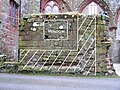 St Bees Priory, Cumbria: Squint window in the wall of chapel built 1270–1300. Window is infilled, but outline is shown, and cross hatch shows wall and floor abutments.
