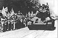 Tank unit of the Korean People's Army enters the streets of Seoul while being welcomed by the Korean people