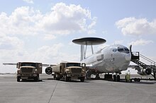 Two R-11 fuel trucks refuel an E-3 Sentry at the 380th Air Expeditionary Wing during 2009.