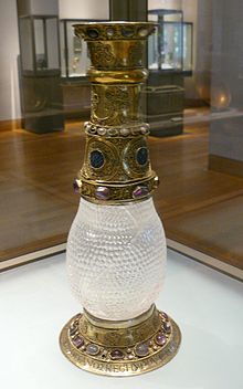 The rock crystal vase belonged to Eleanor's grandfather, William which she gave to Louis as a wedding present, He later donated it to the Abbey of Saint-Denis. Later it was placed in the Louvre