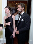 Hepburn wearing an off-the-shoulder satin black evening gown in 1981