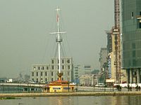 Thủ Ngữ flagpole, behind is the ventilation tower of Thủ Thiêm Tunnel