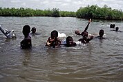 Children swimming near Lamin Lodge.