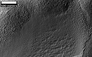 Possible Glacial Cirque in Hellas Planitia, as seen by HiRISE, under the HiWish program. Lines are probably due to downhill movement.