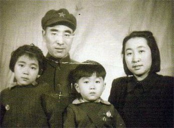 Lin Liguo (center) with his family