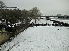 Long line of people on a snowy day