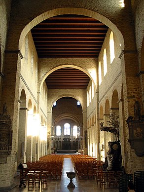 St Gertrude, Nivelles, Belgium, (consecrated 1046) has a nave and aisles divided by piers supporting a clerestorey. The nave is divided by transverse arches. The interior would have been plastered and painted.