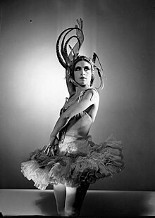 Black and white photo of a woman posing as the Firebird