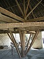Main axle of mill. Roof truss above is separate; mill's own tie beam visible between.
