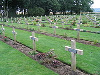 Graves of unknown French soldiers killed during World War One. Each concrete cross has a metal plaque bearing the word "Inconnu" i.e. "Unknown"