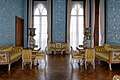 The Blue Drawing Room with intricate plasterwork decorating the walls.