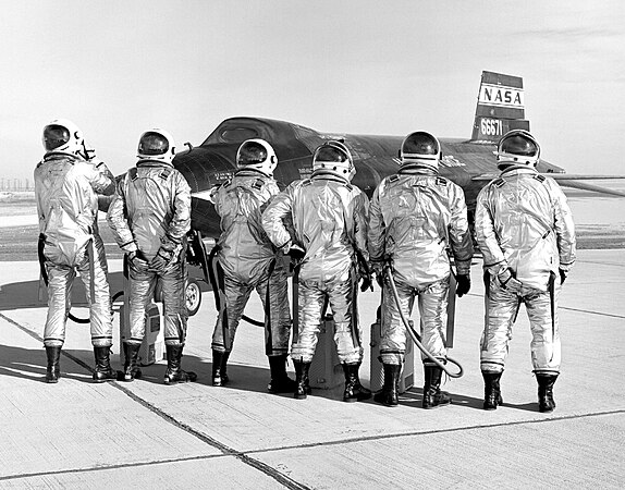 The X-15 pilots clown around in front of the #2 aircraft. From left to right: Joseph Engle, Robert Rushworth, John McKay, William Knight, Milton Thompson, and William Dana.