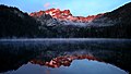 Sierra Buttes reflected in Sardine Lake at sunrise