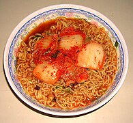 Shin Ramyun is often eaten with kimchi as a topping or on the side.