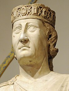 Stone head wearing crown