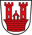 Große Kreisstadt Rothenburg ob der Tauber In Silber eine schwebende rote Burg mit zwei Zinnentürmen, dazwischen ein spitzbedachtes rotes Häuschen.