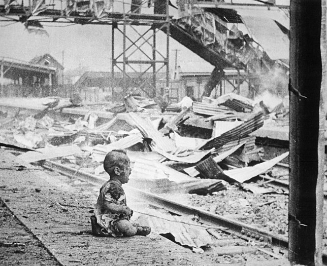 Bloody Saturday – baby crying on a platform of Shanghai's South Station after aerial bombing by Japanese forces, 28 August 1937 (created by H. S. Wong ; restored and nominated by Yann)