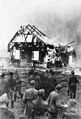 Image 48German soldiers and locals watch a Lithuanian synagogue burn in 1941. (from History of Lithuania)