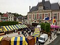 The town square during a festival, with the "new" Hôtel de Ville