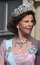 Queen Silvia of Sweden wearing a pink dress and the Pink Topaz Demi-Parure paired with a diamond tiara, 2010