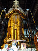Statue of Avalokiteśvara (Migjid Janraisig) in Gandantegchinlen Monastery, Ulaanbaatar, Mongolia. The tallest indoor statue in the world, 26.5-meter-high, 1996 rebuilt, (1913)