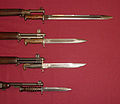 US military bayonets; from the top down, they are the M1905, the M1, M1905E1 Bowie Point Bayonet (a cut down version of the M1905), and the M4 Bayonet for the M1 Carbine. The top 3 blades each have fullers
