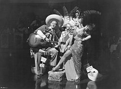 Promotional picture with Andy Russell as a Latin musician and Miranda in her usual costume