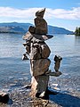 Inuksuk on shore of sw̓iw̓s Provincial Park, looking south over Osoyoos Lake toward Washington state in the distance, July 2020