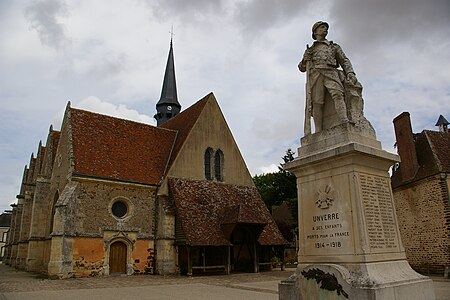 Church at Unverre with Charpentier's war memorial in foreground Eure-et-Loir.