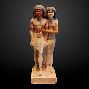 Statue of Raherka and Meresankh. Raherka is depicted with realistic looking musculature