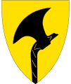 The former coat of arms of Telemark county between 1970-2019 showing a rising peasant axe.