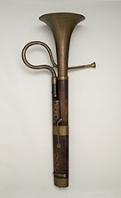 An early cimbasso, originally a form of upright serpent