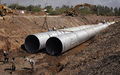 114" pipe installation; Pipe: 114" aluminized type 2; Flow: 25 cubic meters/second; This is a storm drain in Guasave, Mexico.