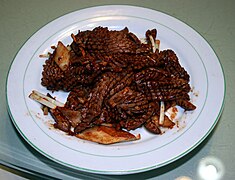 Stir-fried pig's kidney (爆炒腰花; bàochǎoyāohuā)