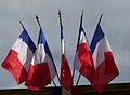 Multiple French flags as commonly flown from public buildings