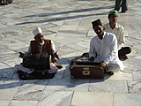 Sufi singers in front of the building