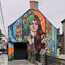 Art mural in Dundalk depicting the duality of Brigid the pagan goddess and Brigid the saint.