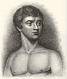 A black and white lithograph of Victor of Aveyron as a teenager from the chest up and shirtless, with his body facing forward and his face slightly turned to the left.