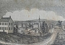 Black-and-white engraving of a village, depicting a road and several two-story buildings