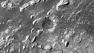 Crommelin crater showing layers in buttes and inside a small crater, as seen by CTX camera. Note: this is an enlargement of a previous image.